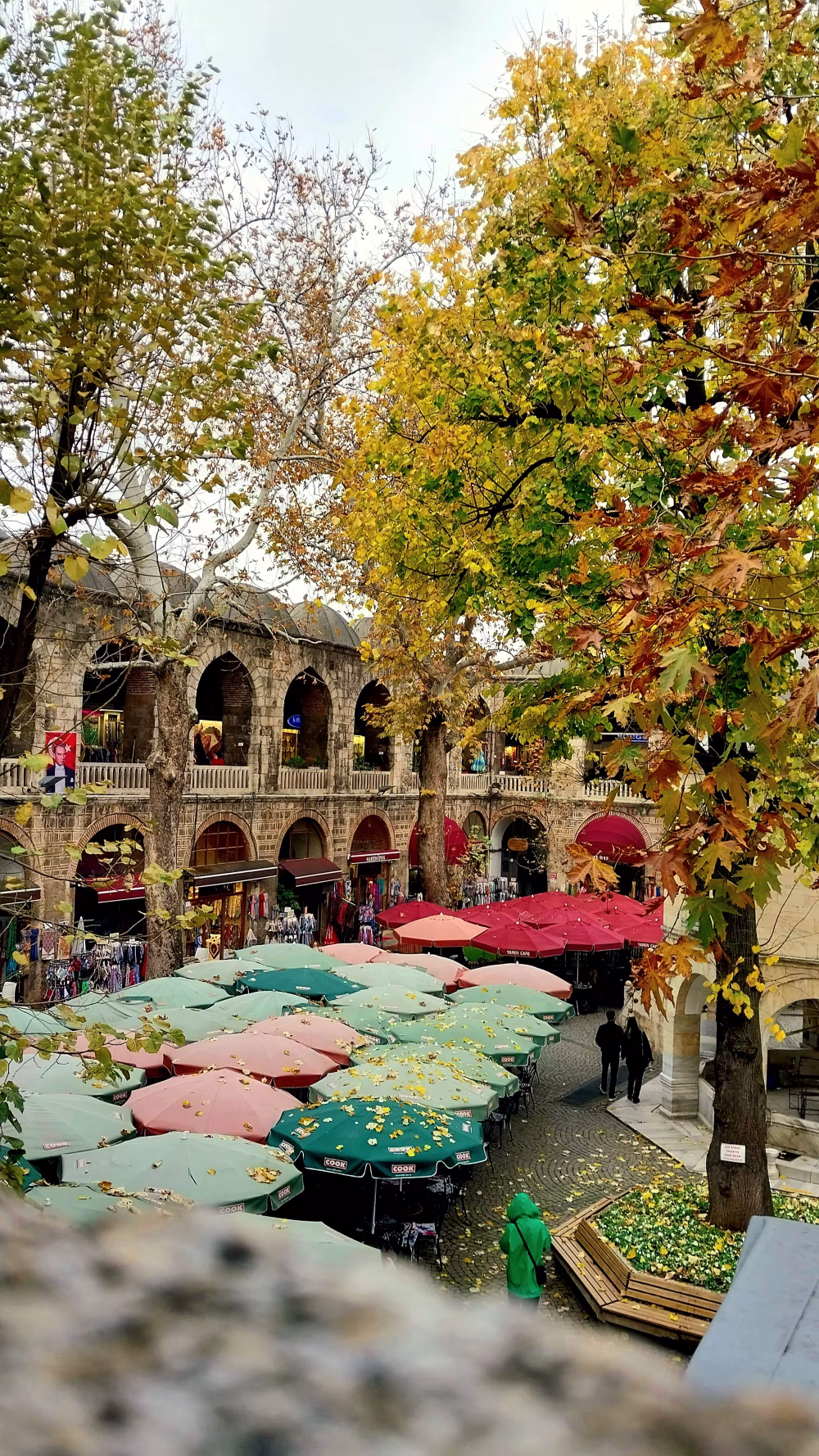 Charming Outdoor Market with Colorful Canopies and Ancient Architecture