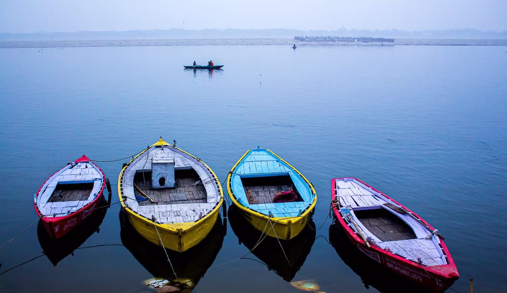 Colorful Boats Docked on a Calm Lake During Overcast Weather