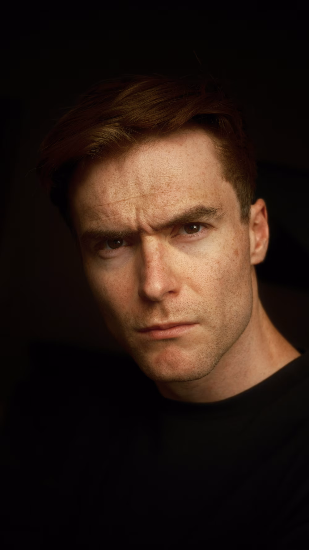 Focused Portrait of a Serious Man in Dimly Lit Atmosphere