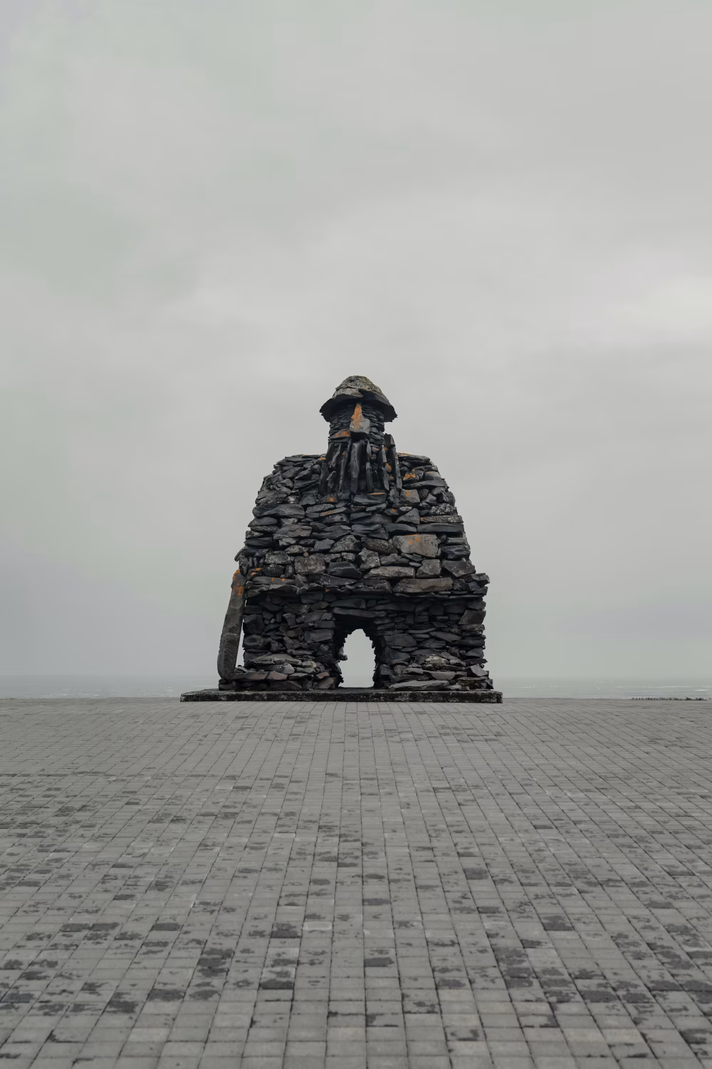 Large Stone Monument on Overcast Day With Open Horizon
