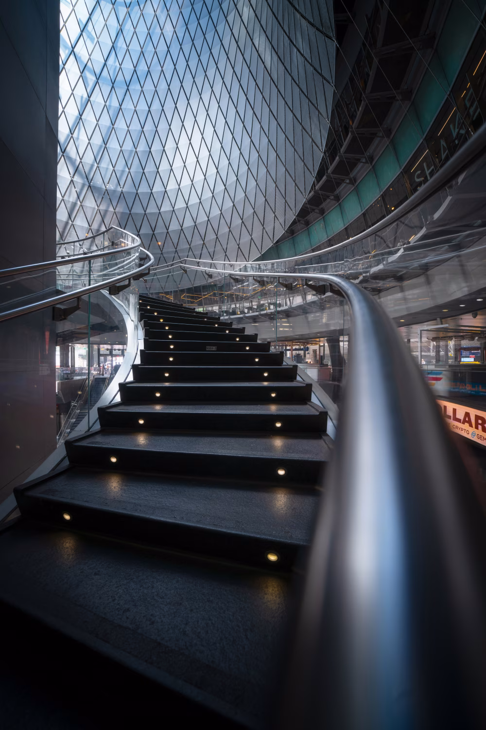 Modern Spiral Staircase in a Glass-Enclosed Architectural Space