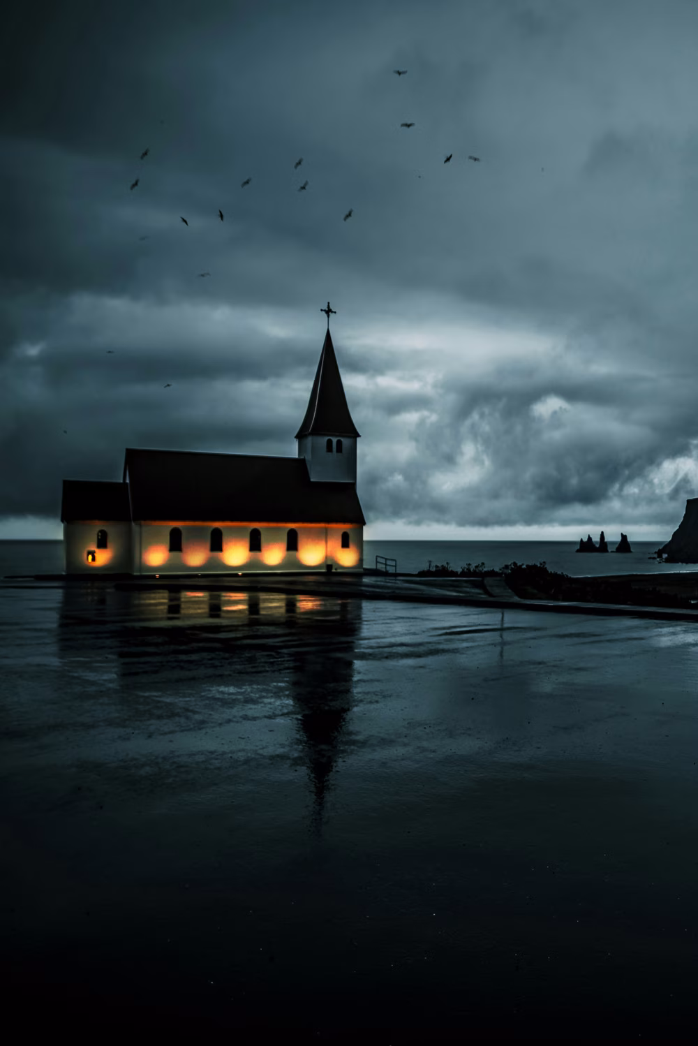 Moody Evening Churchscape Reflecting on Wet Grounds Under Cloudy Sky