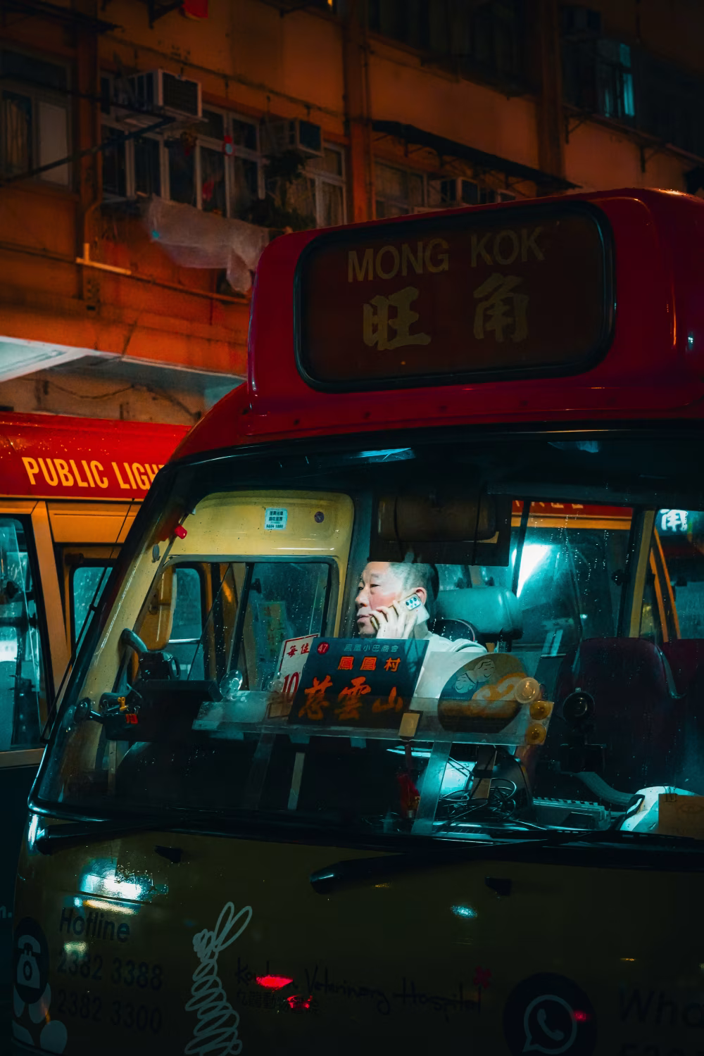 Night View of a Minibus in a Bustling Urban City