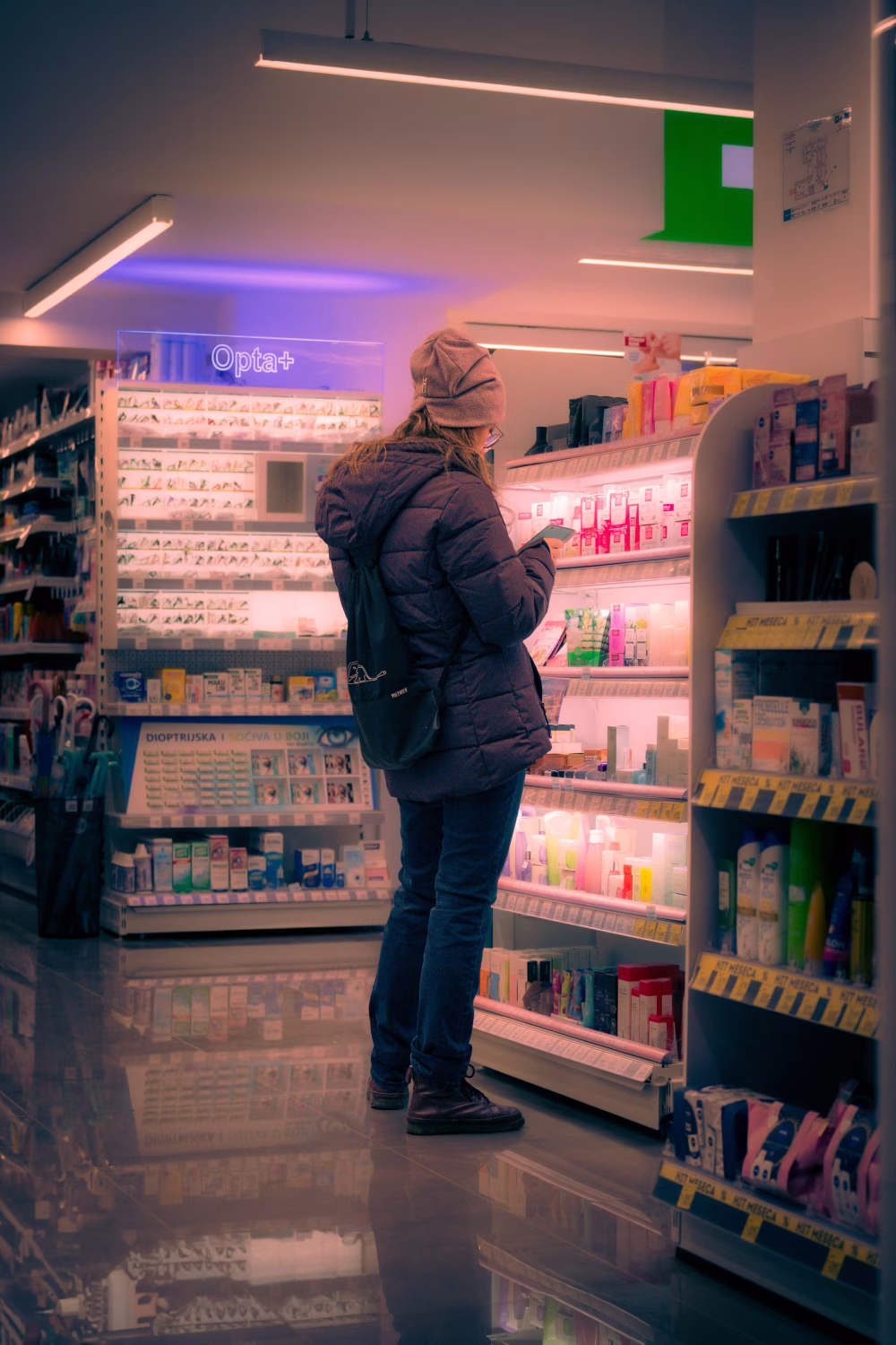 Person Shopping For Skincare Products in a Well-Lit Modern Drugstore