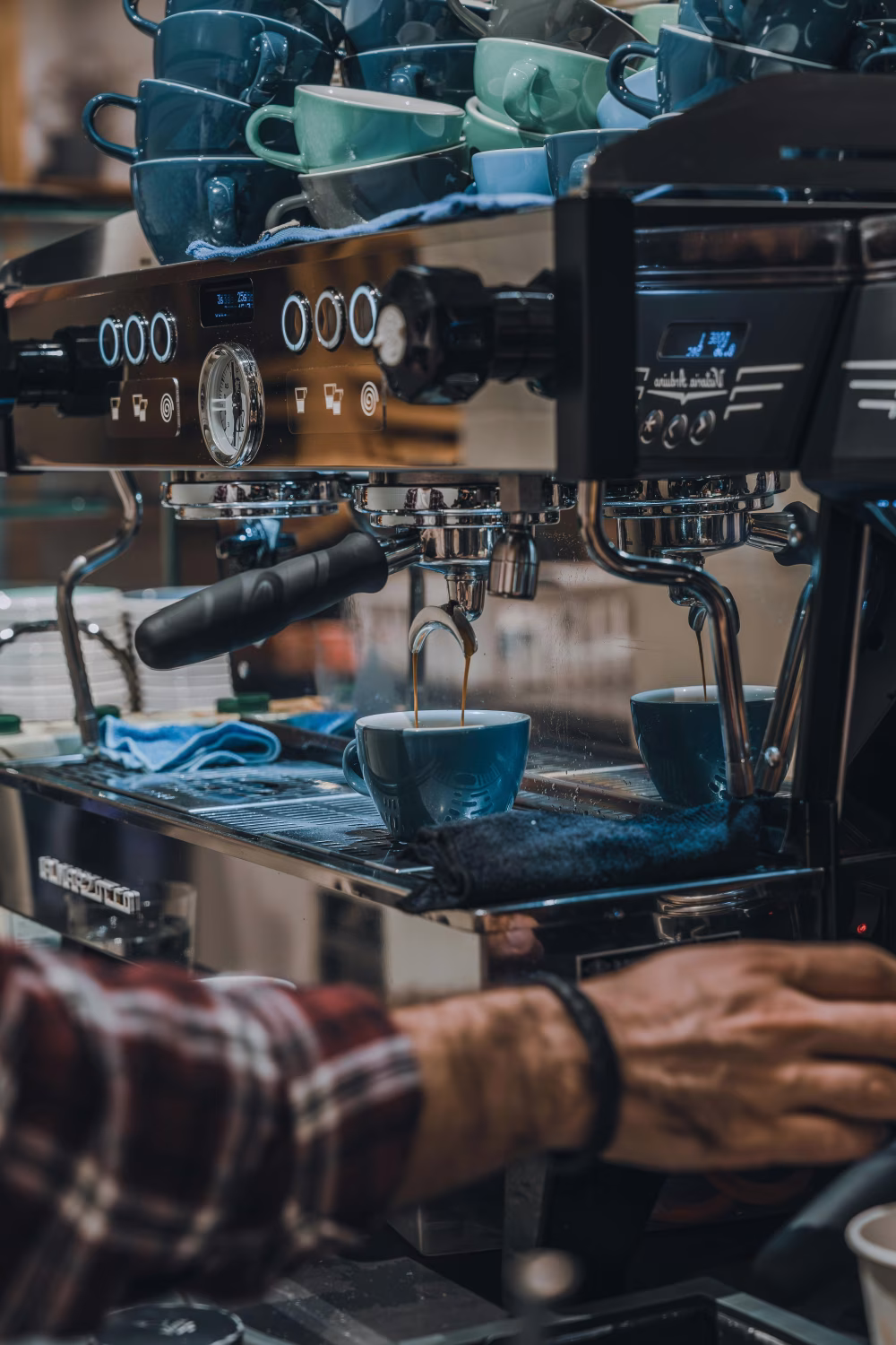 Professional Barista Preparing Coffee with a Modern Espresso Machine