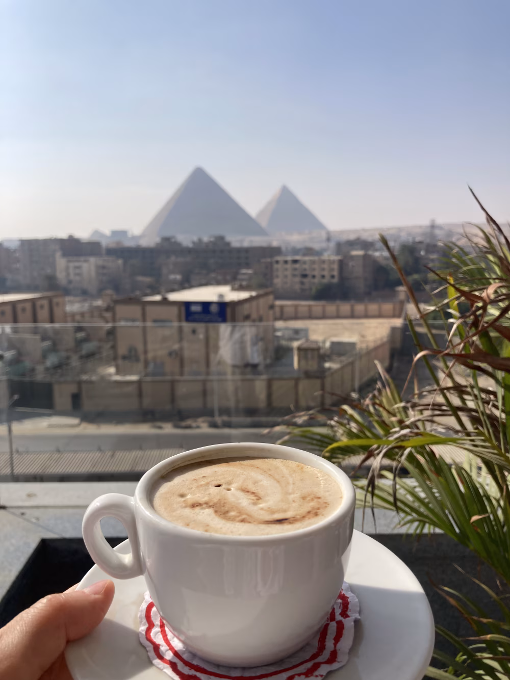 Relaxing With a Cup of Coffee and a View of Iconic Pyramids