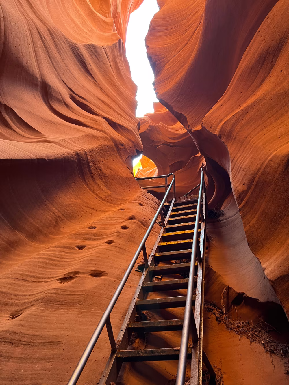 Rustic Staircase Inside a Slot Canyon with Striking Orange Rock Formations
