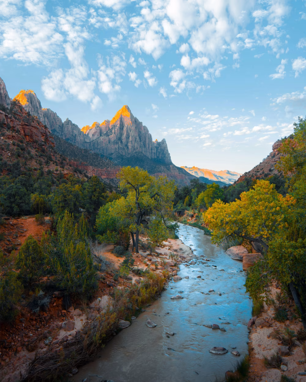 Serene River Landscape With Majestic Mountain and Lush Foliage Under Vibrant Sky
