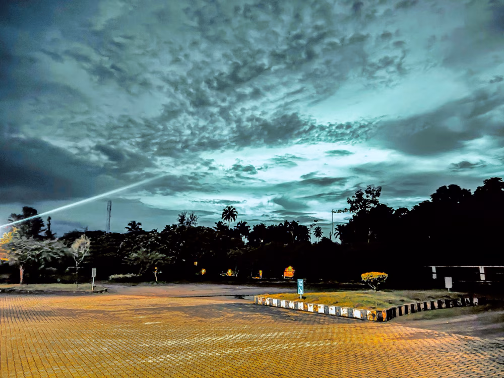 Serene Twilight Sky With Dramatic Clouds Over a Quiet Parking Area