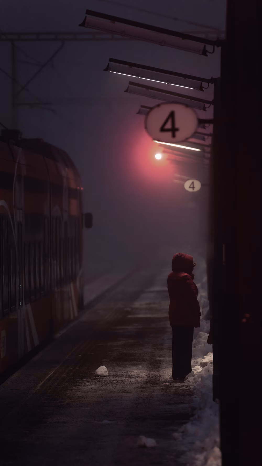 Solitary figure at night train station