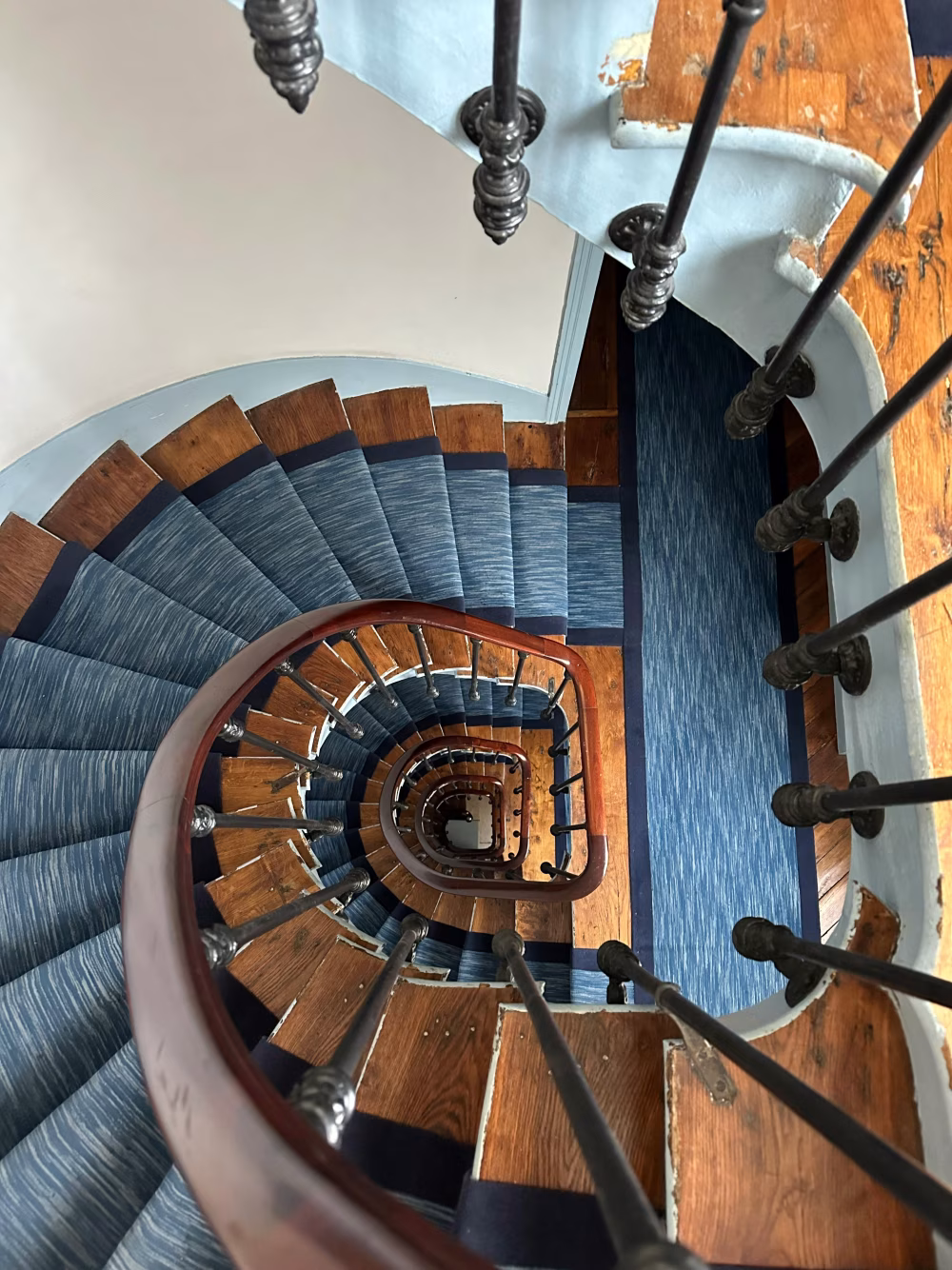 Spiral Staircase Design Captured from a High Angle Perspective Indoors