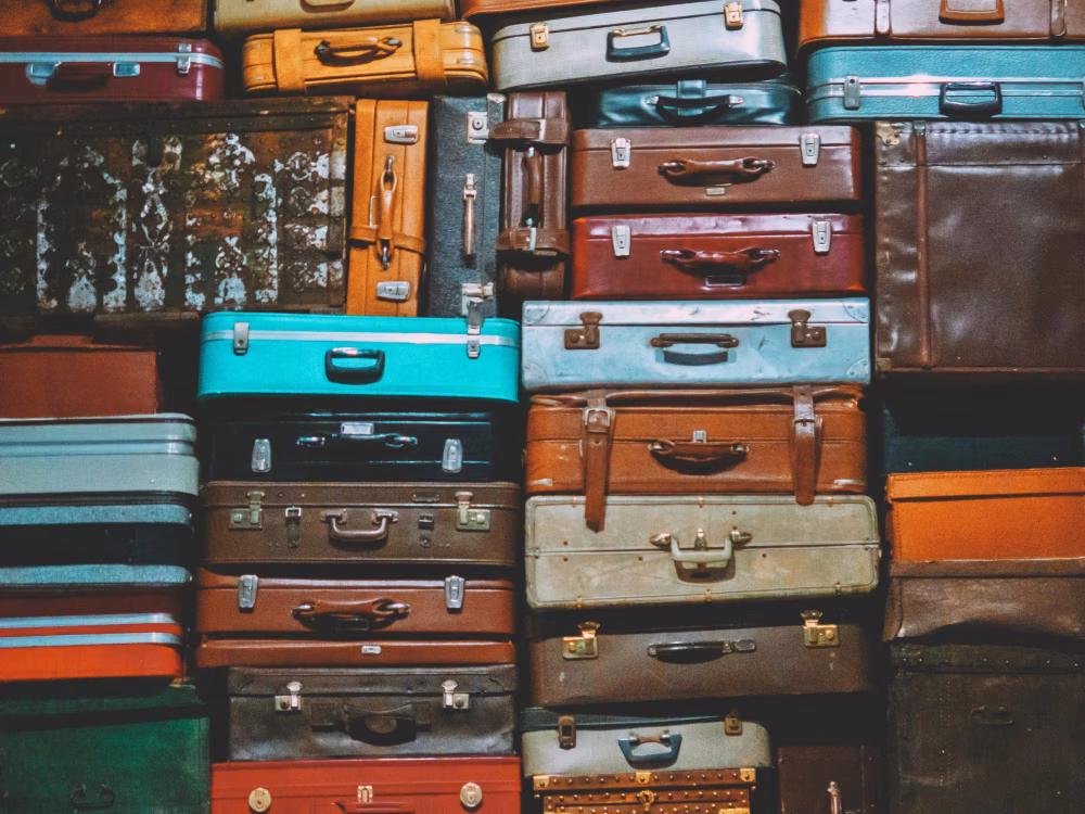 Stacked Vintage Suitcases in Various Colors and Designs