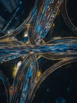 Aerial View of Illuminated Urban Highway Interchange During Night Hours