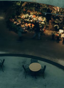 Atmospheric Flower Shop with Tables and Chairs in Cozy Setting