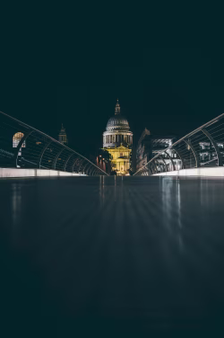 Illuminated Cathedral Seen from the Perspective of Millennium Bridge at Night