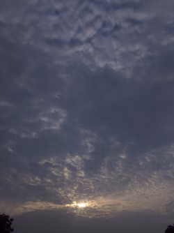 Peaceful Sunrise Over a Cloudy Horizon With Soft Blue Shades