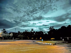 Serene Twilight Sky With Dramatic Clouds Over a Quiet Parking Area
