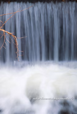 Serene Waterfall Flowing Through Rocky Terrain with Cascading Streams
