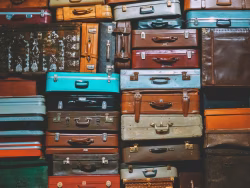 Stacked Vintage Suitcases in Various Colors and Designs