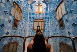 Tourist Capturing Stunning Blue Tile Interior of Historic Architectural Landmark