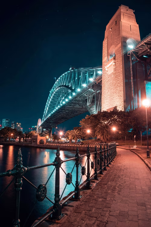 Beautiful Night Photography of a Bridge Illuminated Over Calm Waters