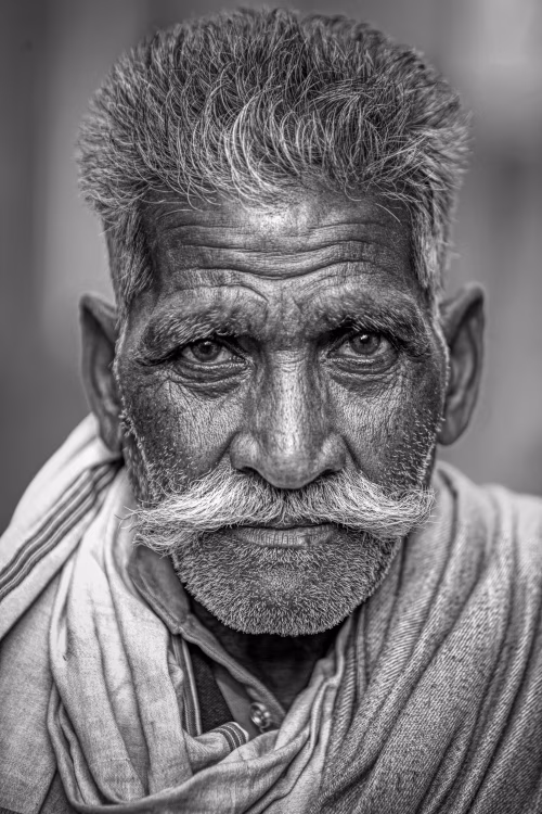 Black And White Portrait of Elderly Man with Expressive Features and Strong Gaze