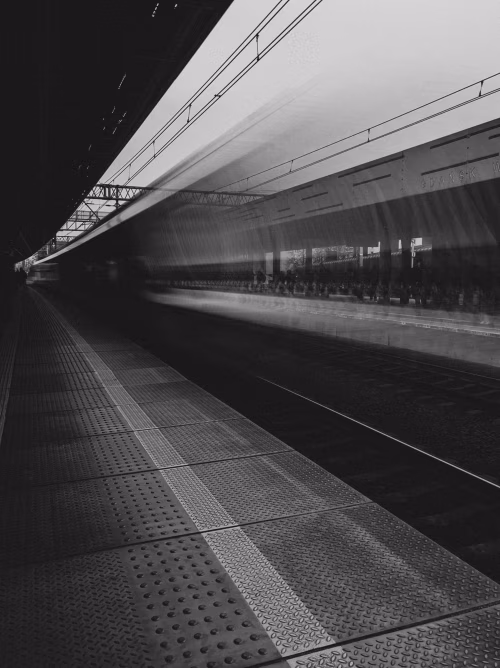 Black and White Urban Train Station with Motion Blur of Train