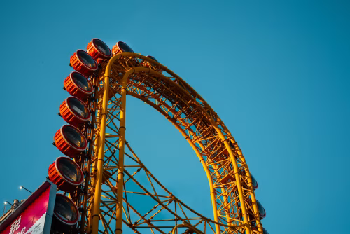 Bright Ferris Wheel Structure Against a Clear Blue Sky