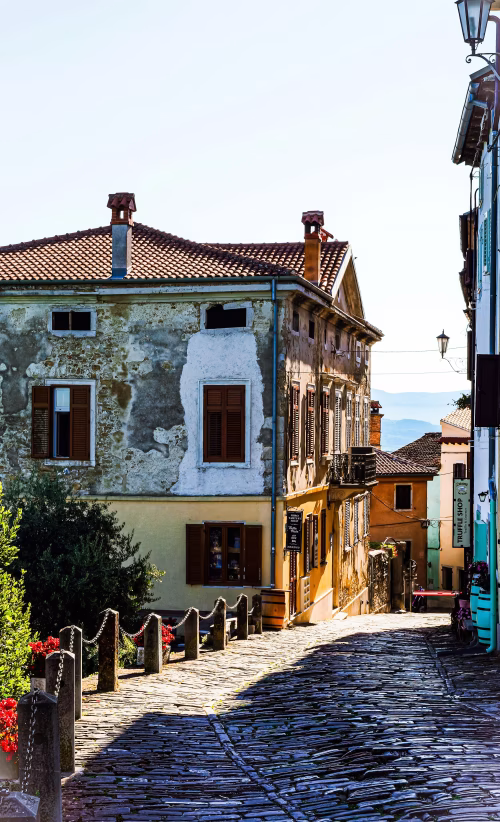 Charming Old Town With Weathered Buildings and Cobblestone Street
