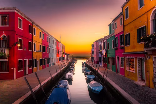 Colorful Canal Sunset in a Picturesque Italian Village Setting