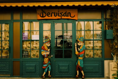 Colorful Exterior of a Traditional Cafe with Decorative Figures