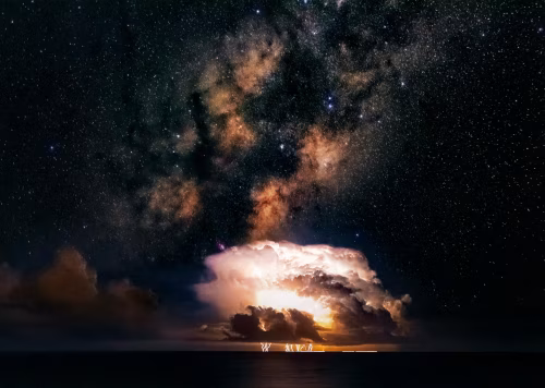 Cosmic Display of Lightning Beneath a Vast Starry Milky Way Sky