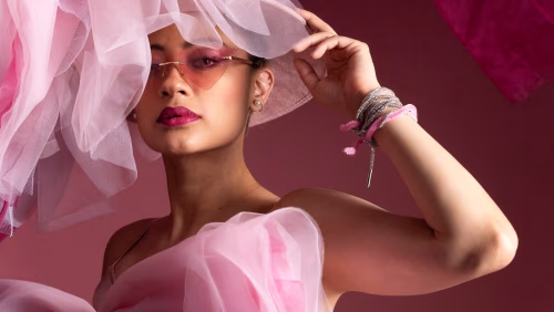 Fashionable Woman Posing in Pink Attire With Stylish Accessories