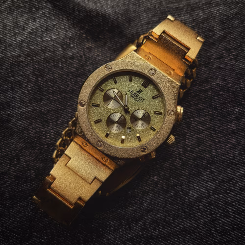 Golden watch on a denim background 1