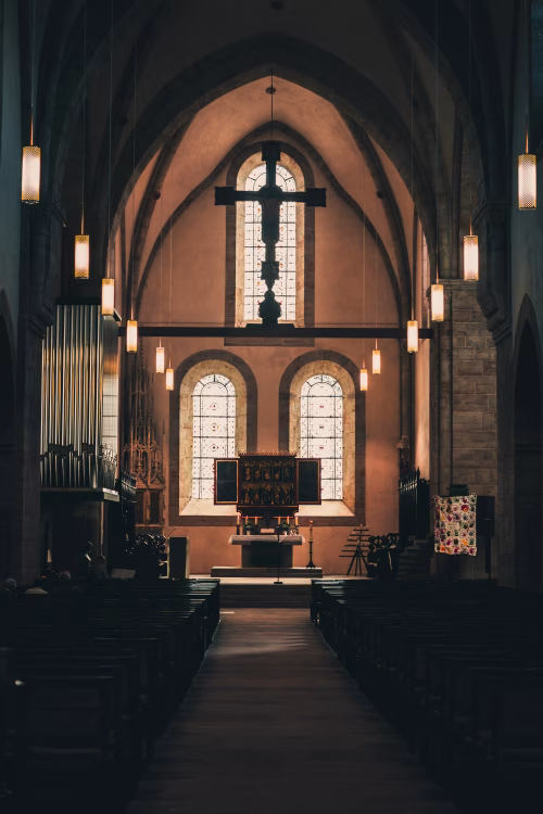 Interior View of a Historic Church with Traditional Decorations and Lighting