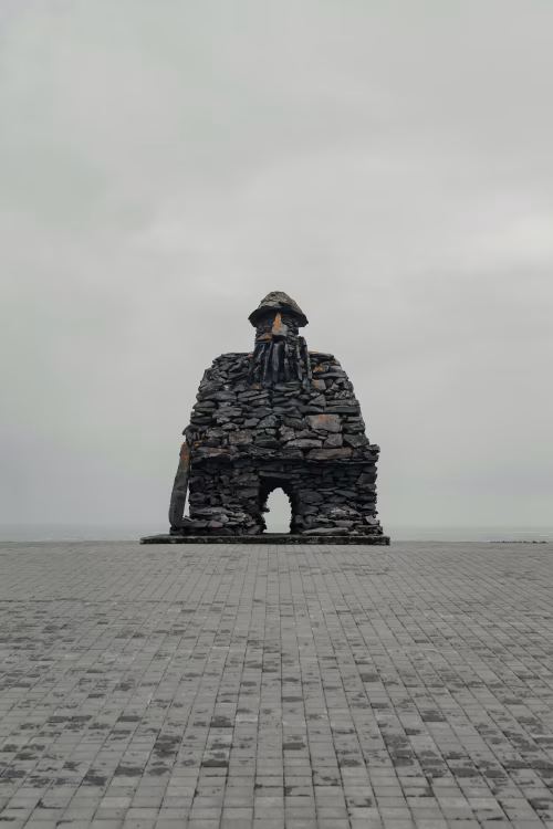 Large Stone Monument on Overcast Day With Open Horizon