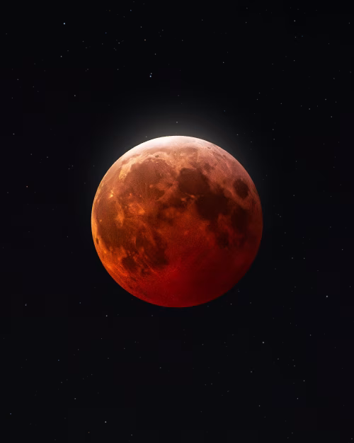 Lunar Eclipse Illuminating the Night Sky with a Deep Red Glow