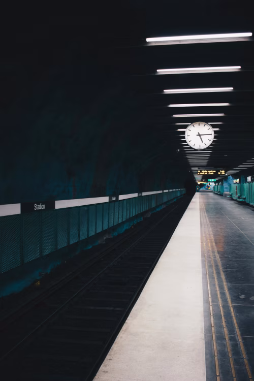 Minimalist Underground Station Platform with Clock in Low Light Setting