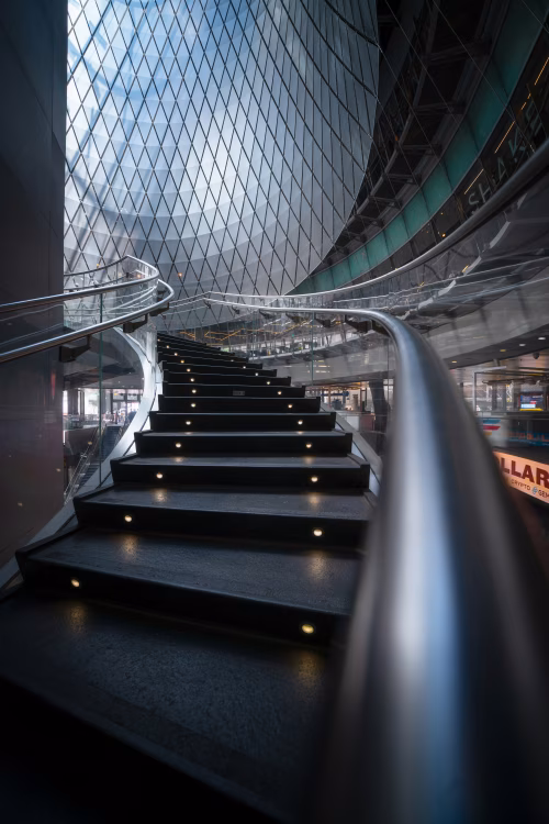 Modern Spiral Staircase in a Glass-Enclosed Architectural Space