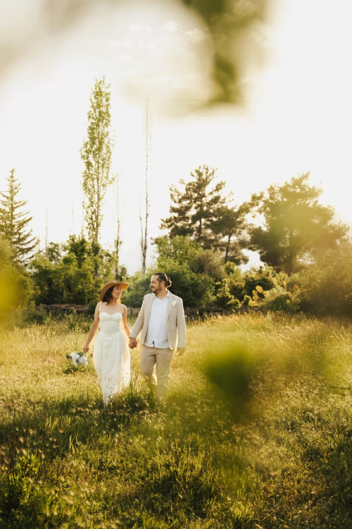 Romantic Couple Walking in a Picturesque Sunlit Field