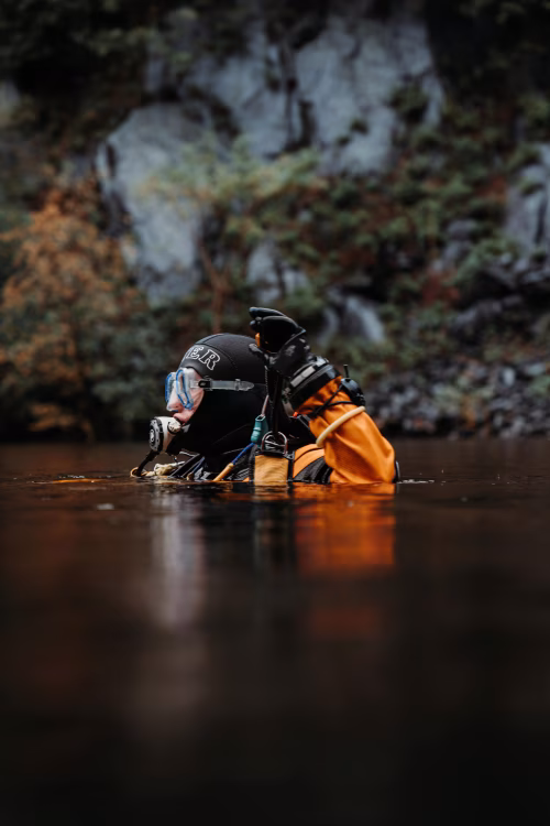 Scuba Diver in Full Gear in a Calm River Setting