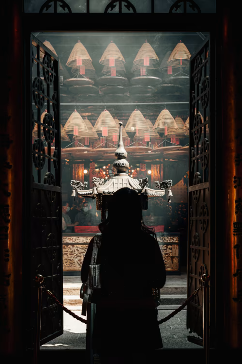 Silhouette of a Visitor at a Traditional Asian Temple Interior