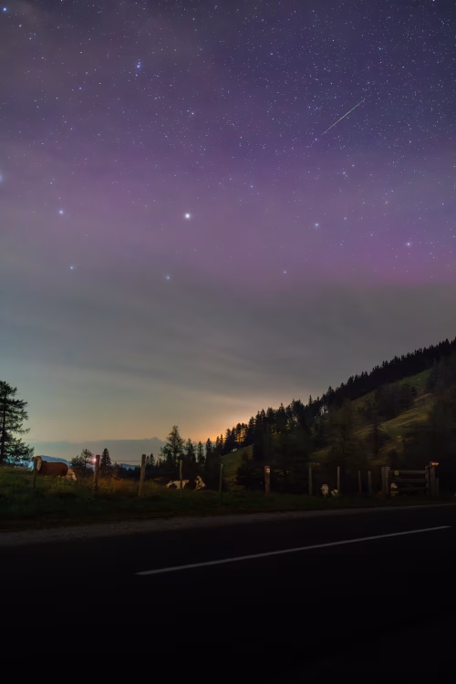 Starry Night Sky Above Peaceful Mountain Pasture Scenery at Twilight