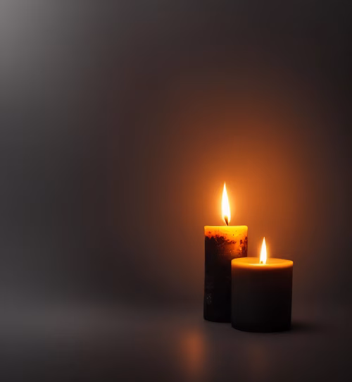 Two Lit Candles Illuminating in a Dark and Serene Background
