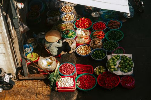 Vibrant Street Market Scene with Assorted Fresh Produce and Vegetables